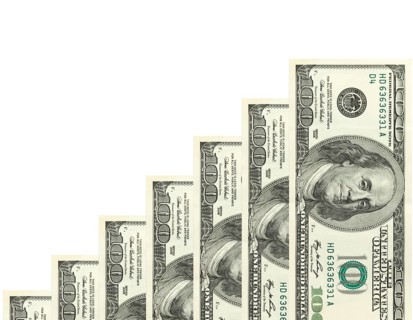 Steps made of dollars on white background