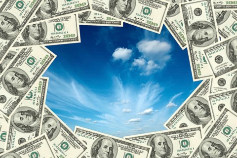 Sky visible throgh frame made of hudred dollars banknotes