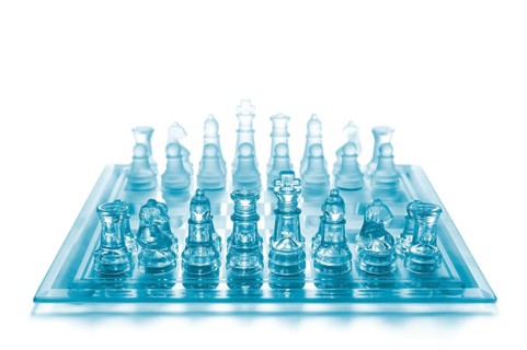 Glass chess on chess board