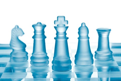 Glass chess on chess board