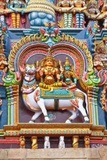 Shiva and Parvati images. Sculptures on Hindu temple gopura