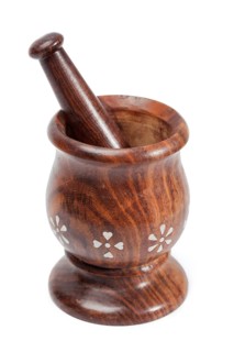 Wooden mortar and pestle isolated white background