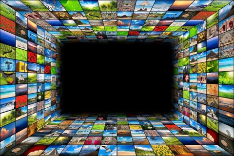 Abstract multimedia background composed of many images with copyspace in the center