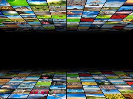Abstract multimedia background composed of many images with copyspace in the center