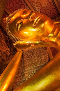 Reclining Buddha gold statue face. Wat Pho