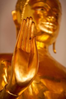 Buddha golden statue blessing hand