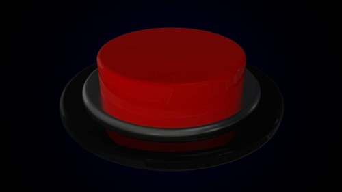 Red round push button bordered by a metallic ring