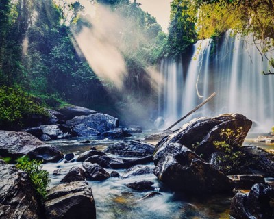 Vintage retro effect filtered hipster style image of tropical waterfall Phnom Kulen