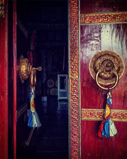 Vintage retro effect filtered hipster style image of open door of Spituk Gompa