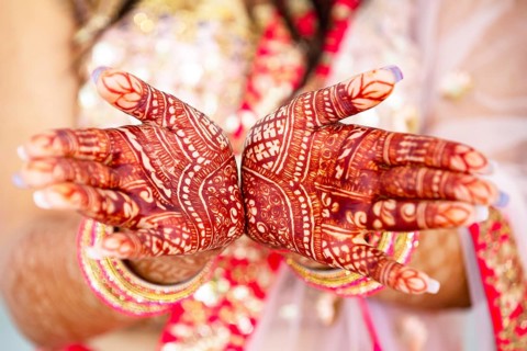 Beautiful henna design on hand of Hindu bride