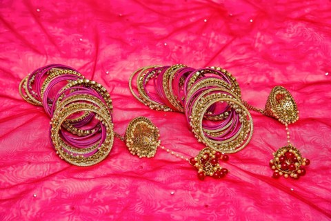 Closeup of Hindu brides bangles on red