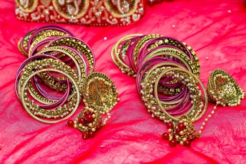 Closeup of Hindu brides bangles on red