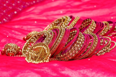 Closeup of Hindu brides bangles on red