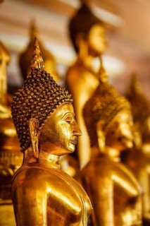 Golden Buddha statues in buddhist temple Wat Saket