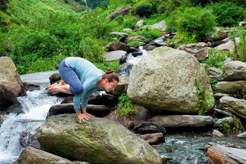 Woman doing Kakasana asana