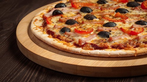 Panoramic image of ham pizza with