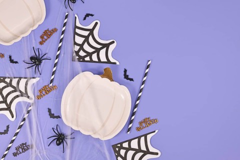 Halloween party flat lay with pumpkin shaped plate
