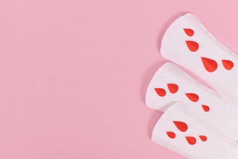 Female period concept with panty liner with symbolic paper blood