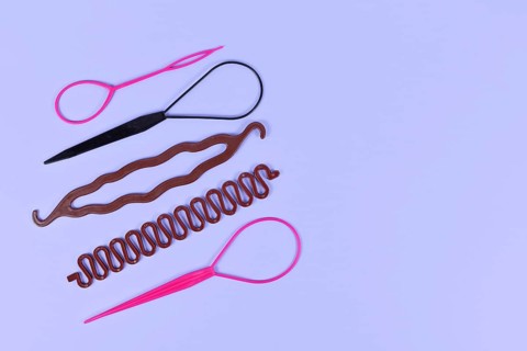 Different hair styling tools like bun maker