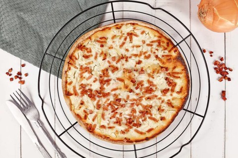 Taditional food 'Tarte Flambee' or 'Flammkuchen' from German-French Alsace border region