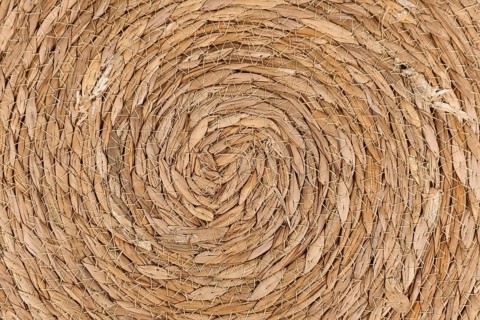 Close up of round weave wicker basket pattern background