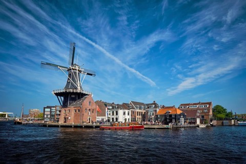 View of Harlem landmark windmill De Adriaan on Spaarne river. Harlem