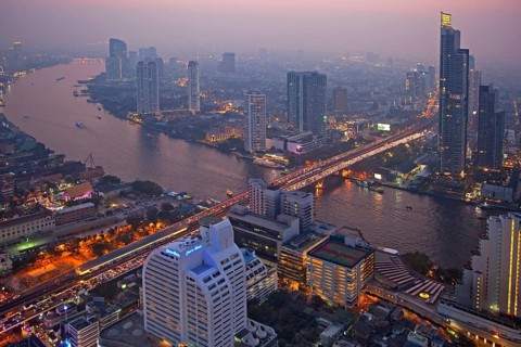 The Bangkok skyline at night and view of the Chao Phraya River