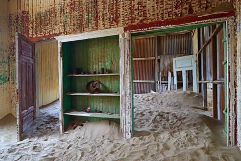 Residential buildings taken over by desert sand