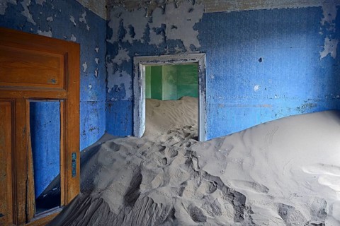 Residential buildings taken over by desert sand