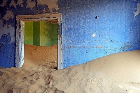 Residential buildings taken over by desert sand