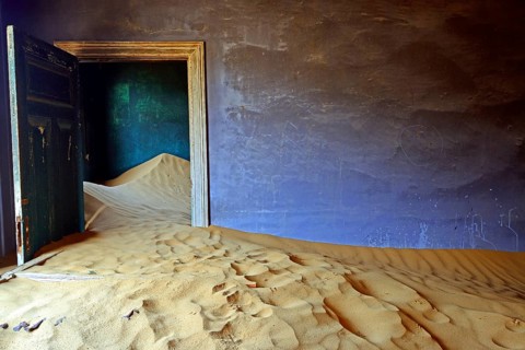Residential buildings taken over by desert sand