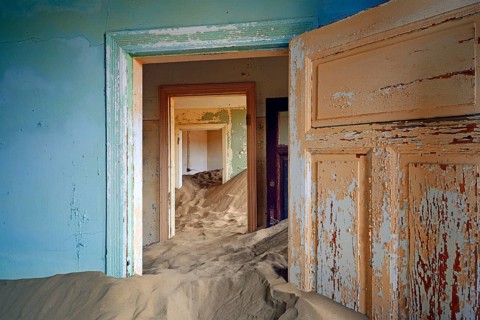 Residential buildings taken over by desert sand