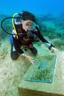 Divers at the memorial plaque of the Galleon nuestra Senora de Guadalupe