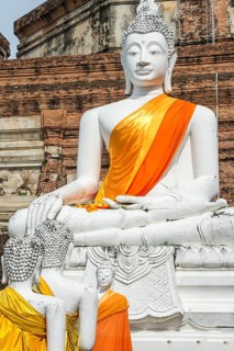 Buddha statues in front of the stupa in Wat Yai Chai Mongkhon