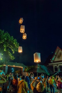 Releasing sky lanterns during the Festival of Lights
