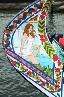 Colourful hand-painted bow of a gondola like Moliceiro