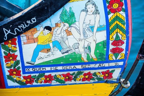 Colourful hand-painted bow of a gondola like Moliceiro