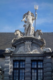 Statue of the Roman god Neptune with trident above the entrance to the Old Fish Market