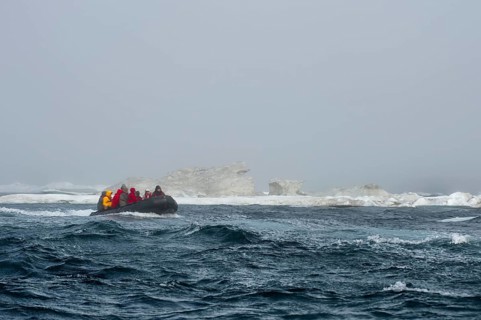 Zodiac with tourists approaching Herald Island