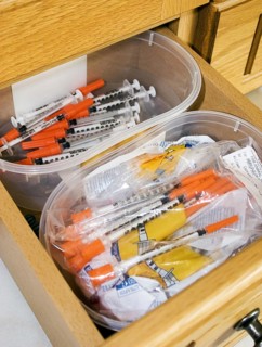 Drawer with insulin syringes for diabetic domestic cats