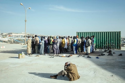 Dockworkers at evening prayer