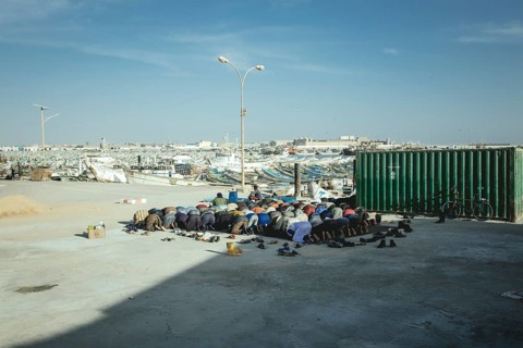 Dockworkers at evening prayer