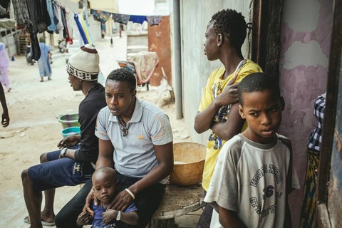 Fisherman and Captain Mukhtar in his house with various family members