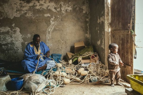 Fishermen mending nets in Nouamghar