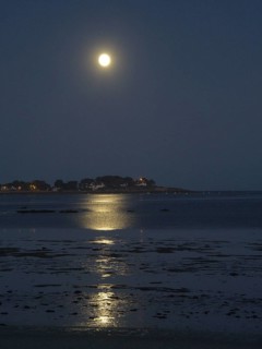 Full moon over the bay of Plouharnel overlooking Pointe Saint Colomban in Brittany