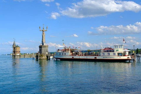 Sculpture Imperia and ship at the harbour entrance
