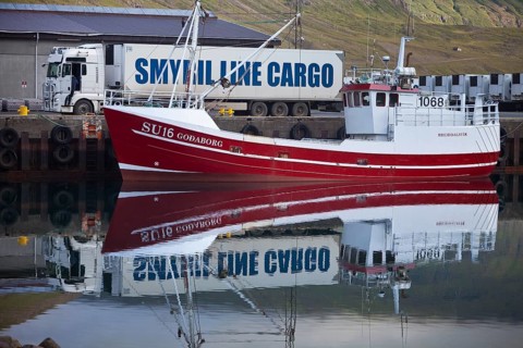 Symril Line Cargo fishing boat and truck in harbour
