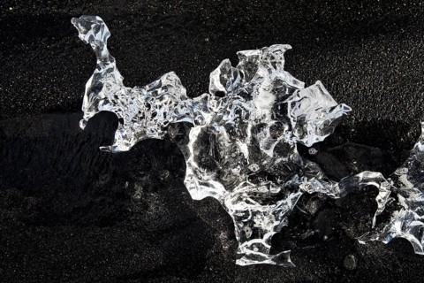 Glacial ice on black beach at Breidarmerkursandur