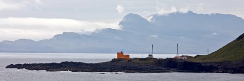 Landscape at Seydisfjoerdur with the lighthouse in Dalatangi