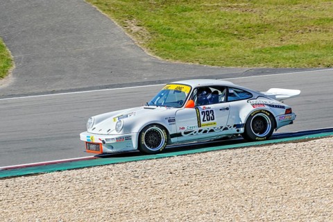 Historic racing car Porsche 911 RS at car racing for classic cars youngtimer classic cars 24-hour race 24h race